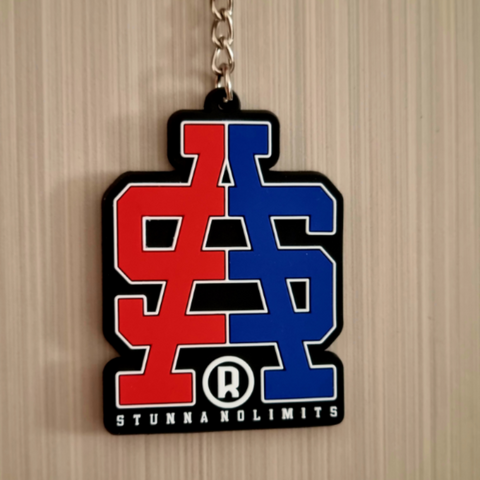 Individual product image, on solid background. Keyring with chain- red and blue spit coloured